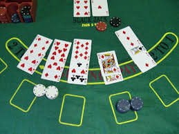 tango777 live-dealer blackjack table on mobile screen with dealer and chat interface